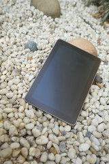 digital tablet on stone