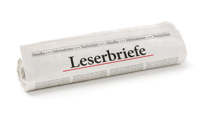 Zeitungsrolle mit der Überschrift Leserbriefe