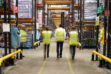 ESSEX, ENGLAND- MAR 13 2016: Staff in reflective vests walking a