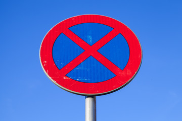 Standing is prohibited. Road sign over blue sky