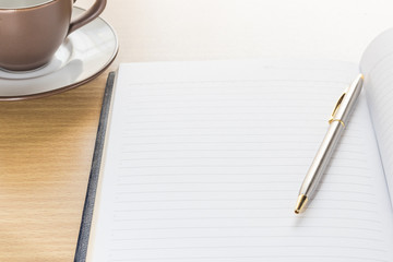 Pen and Notebook open blank page