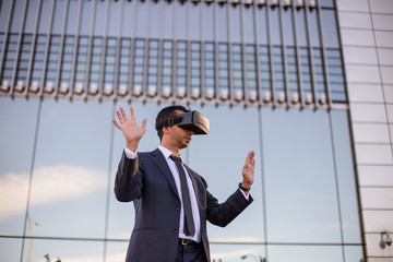 Businessman using virtual reality glasses