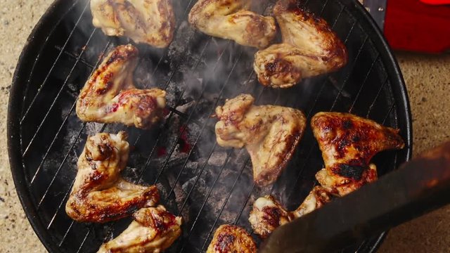 Aerial view on chicken wings on a barbecue
