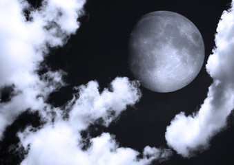 Naklejka na ściany i meble The moon in the night sky in clouds