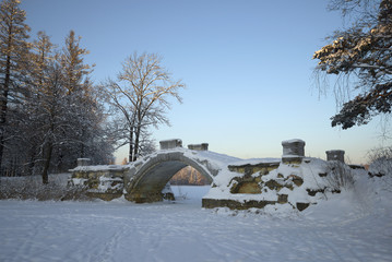 View of Humpback bridge in the january twilight. Gatchina Palace Park, Russia