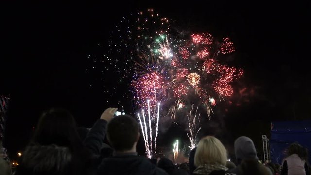 People look at fireworks