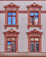 four vintage art window on brick wall pattern