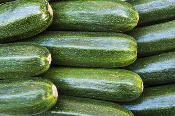 Italian Zucchini in a Row:  Italian Zucchini stacked in a row in a market in Como, Italy