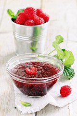 Homemade raspberry jam and fresh raspberry . Rustic style.Selective focus