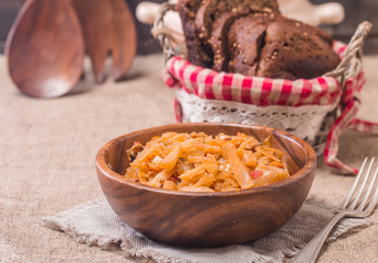 Cabbage stewed  in portions wooden plate