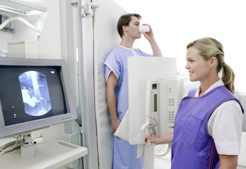 Man swallowing barium during an X-ray
