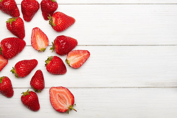 strawberry fruits on wooden background