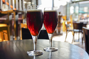 glass of beer on a table in a bar