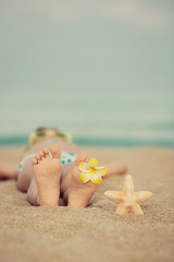 Fototapeta na wymiar Child relaxing on the beach