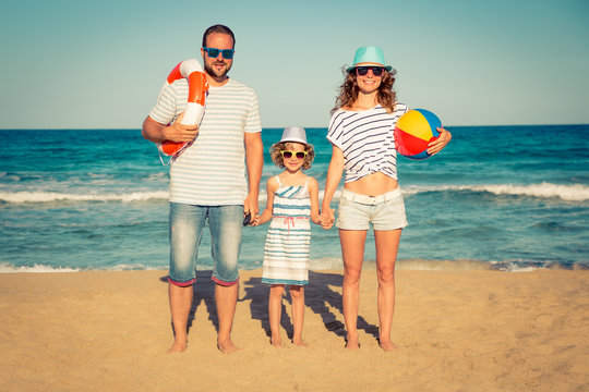 Happy family having fun on the beach
