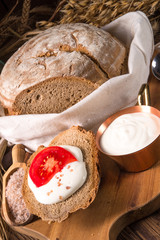 homemade bread with cream and tomato