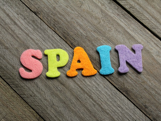 spain word on wooden background
