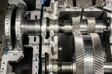 A part of a small steam turbine. Metal gears. Gear wheels of the engine.
