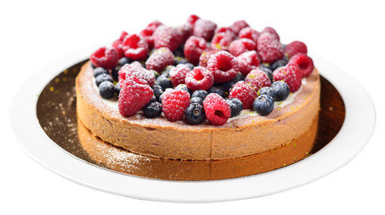 cake with raspberries and blueberries, isolated