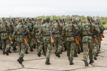 Bulgarian soldiers in uniforms with Kalashnikov AK 47 rifles