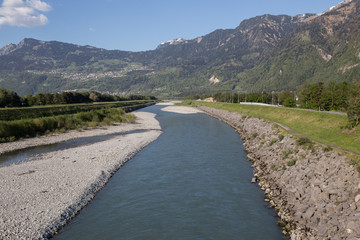 the rhine river between liechtenstein and the swiss