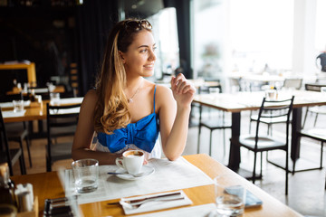 Beautiful woman enjoying her coffee