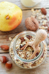 Homemade granola with nuts and raisins. Selective focus