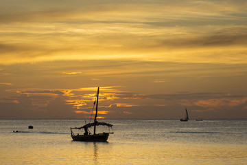 Fototapeta premium Traditional Fisherman Dhow Boat during sunset, Zanzibar, Tanzani