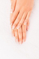 Top view photo of woman's hands with perfect manicure