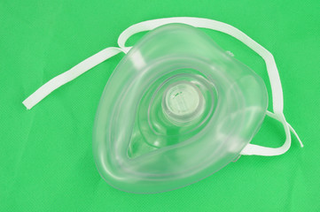 CPR Mask On Green Background