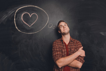 Young romantic boy in love thinking about future date