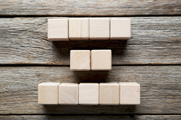 Wooden toy cubes on a grey wooden table