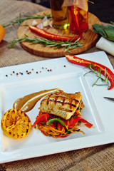 Baked perch fillet with rosemary and lemon with blanched vegetables