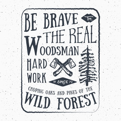 Obraz premium Lumberjack vintage label with two axes and trees. Hand drawn textured grunge vintage label, retro badge or T-shirt typography design, hipster T-shirt print design. Hand drawn vector illustration