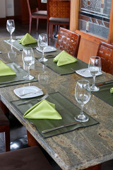 professional restaurant serving: table setting in luxury european restaurant, interior