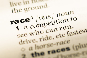 Obraz premium Close up of old English dictionary page with word race