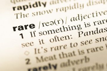 Fototapeta premium Close up of old English dictionary page with word rare