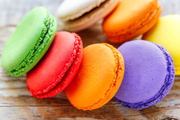 multicolored macaroon cookies on a wooden table