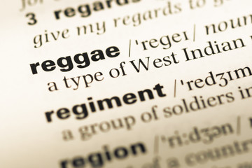 Obraz premium Close up of old English dictionary page with word reggae