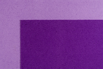 Fototapeta premium Eva foam ethylene vinyl acetate purple surface on light purple sponge plush background