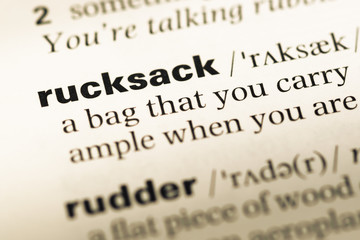 Obraz premium Close up of old English dictionary page with word rucksack