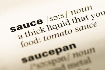Close up of old English dictionary page with word sauce