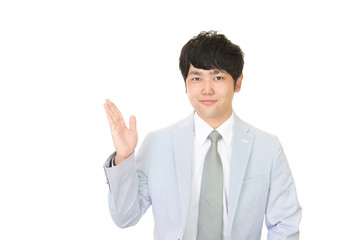 案内する笑顔のビジネスマン