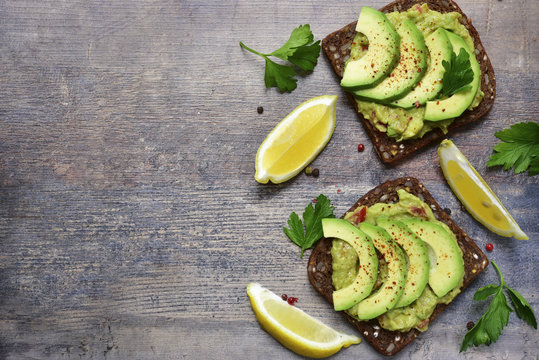 Delicious Wholewheat Toast With Guacamole And Avocado Slices.