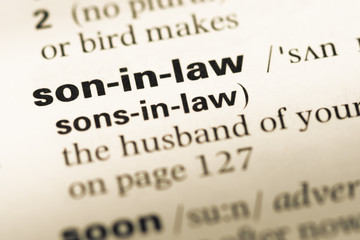 Obraz premium Close up of old English dictionary page with word son in law