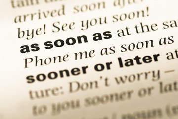 Fototapeta premium Close up of old English dictionary page with word as soon as