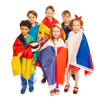 Top view of kids wrapped in European nations flags