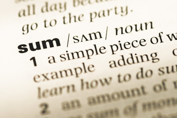 Obraz premium Close up of old English dictionary page with word sum