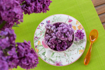 Fresh purple lilac flower bouquet on the cap