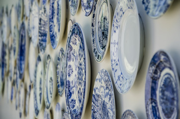 Decorative plates from Holland. Dutch souvenir plates on the wall.